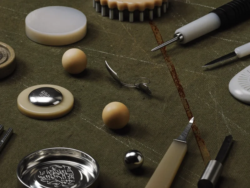 Illustrative cutters, embossers and modelling tools laid flat on a worn cutting mat